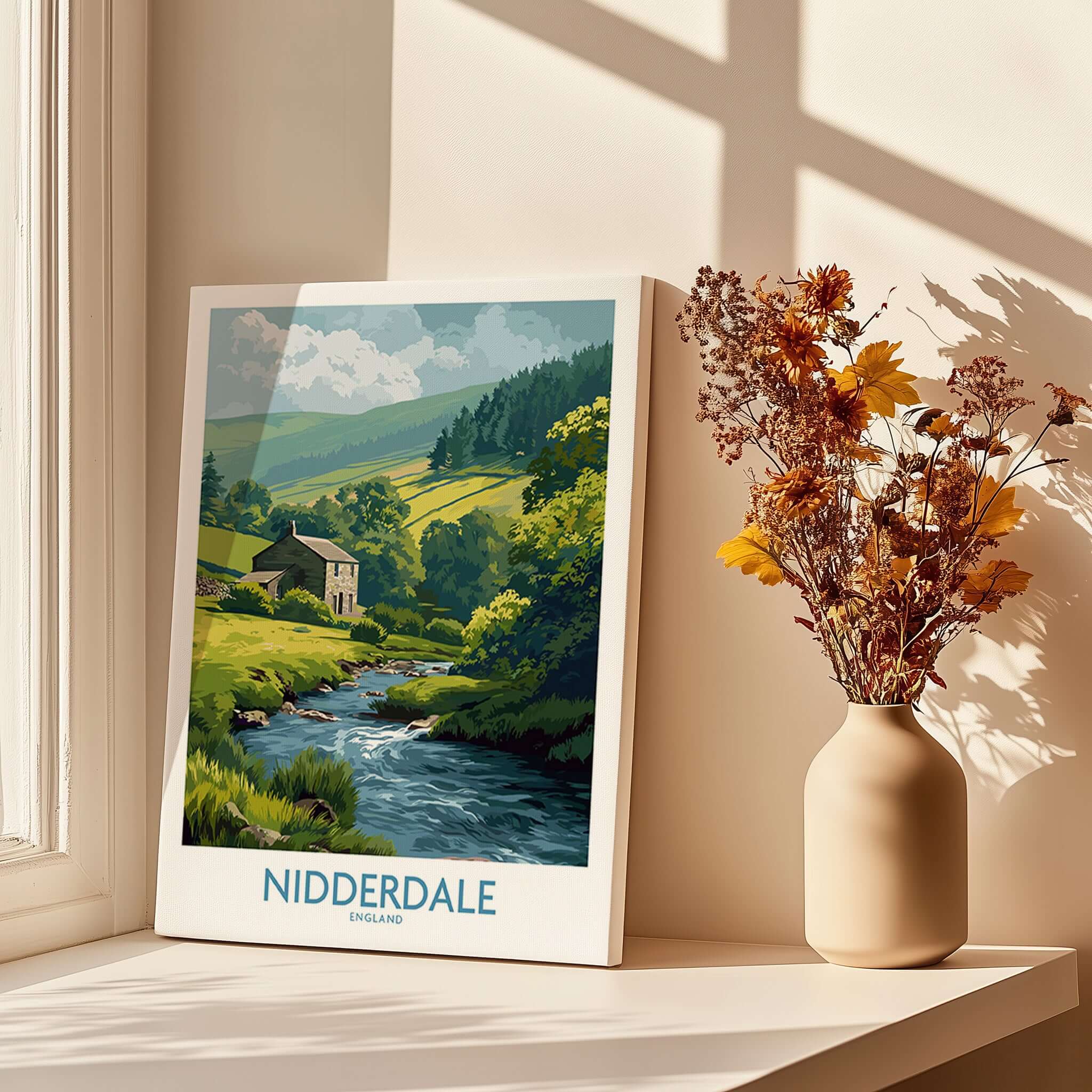Nidderdale England Riverside Cottage Art Print | Yorkshire Valley Poster displayed on a windowsill with flowers.