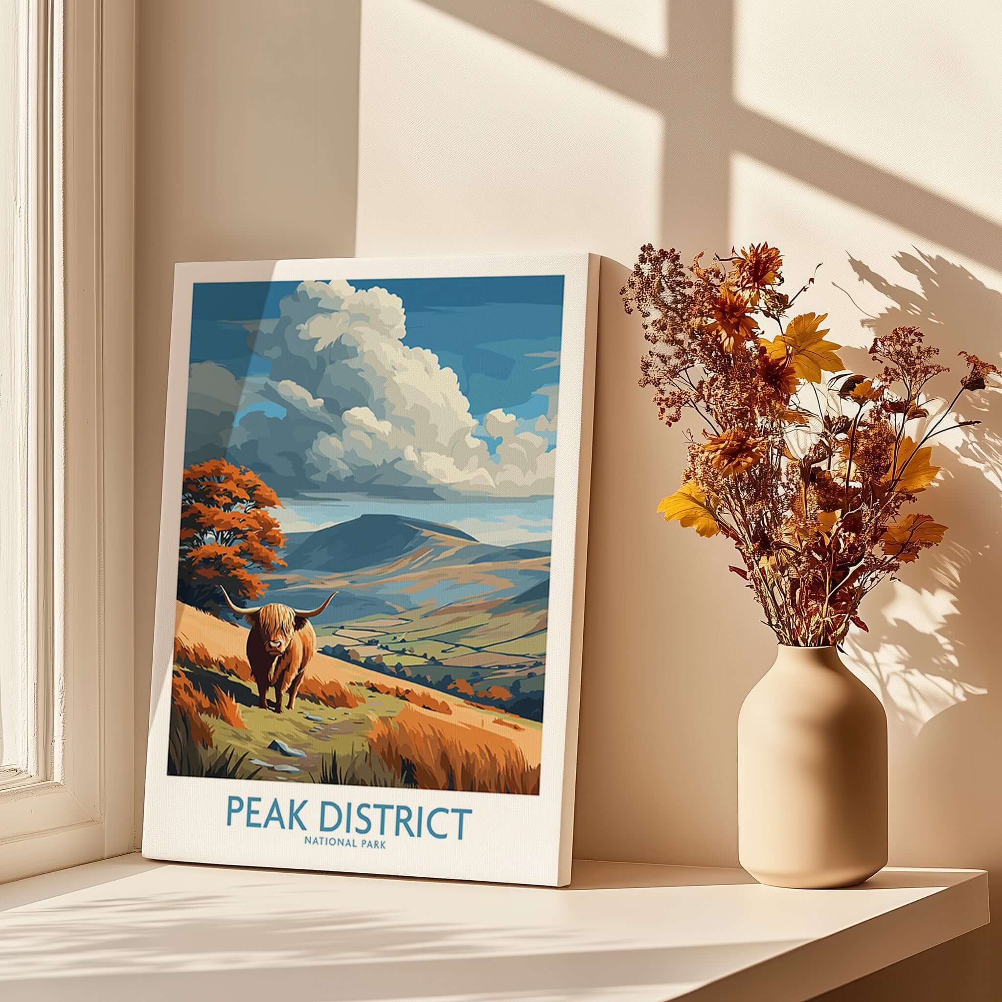 Peak District National Park Highland Cattle Art Print | Rolling Hills Poster displayed in sunlight near flowers.