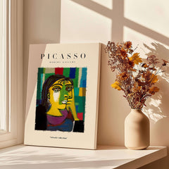 Picasso Contemplative Woman Abstract Art Print Colorful Portrait Poster Artwork Collection displayed in a bright room with flowers.