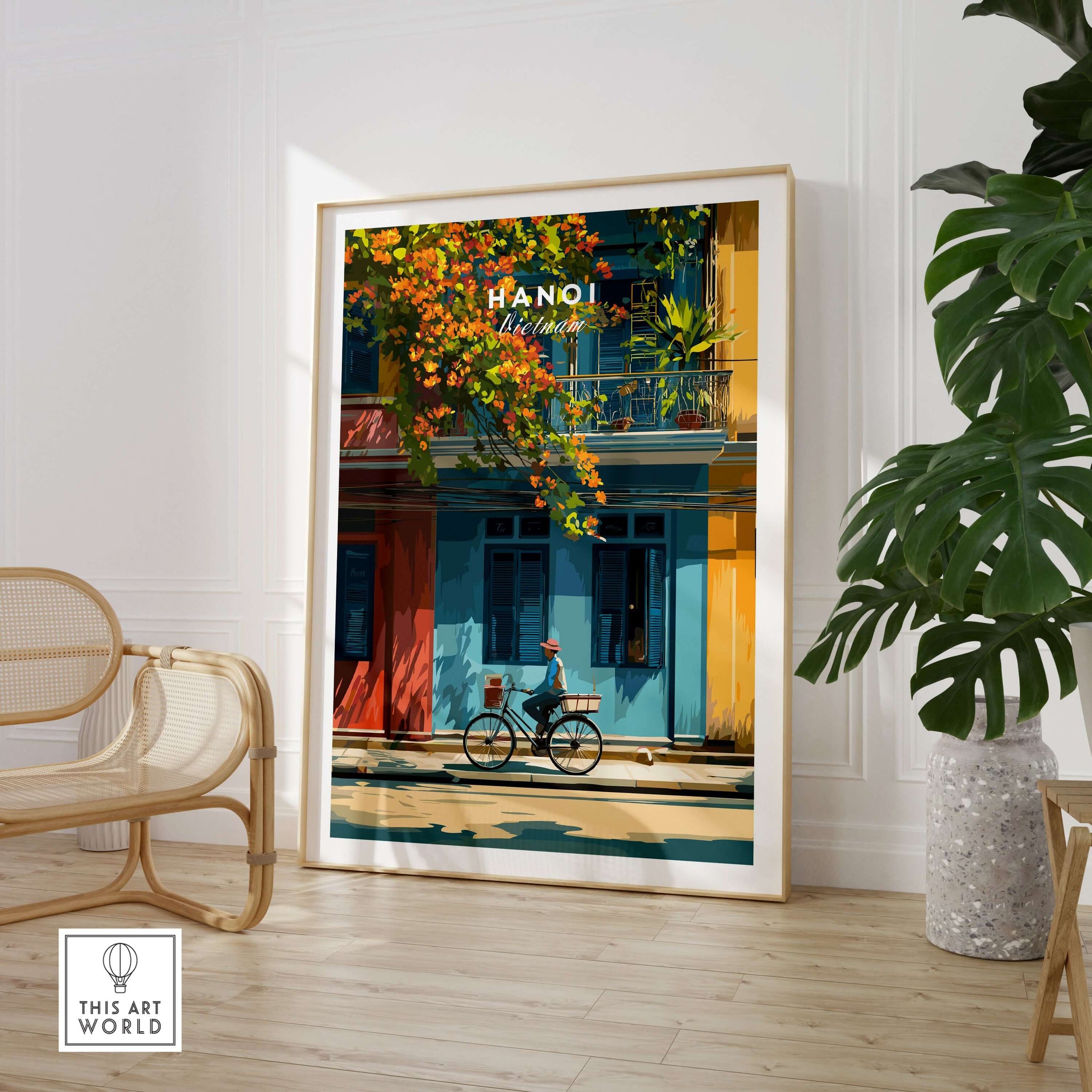 Hanoi Vietnam Print - Vibrant Hanoi Wall Art featuring a cyclist and colorful buildings in a cozy interior setting.