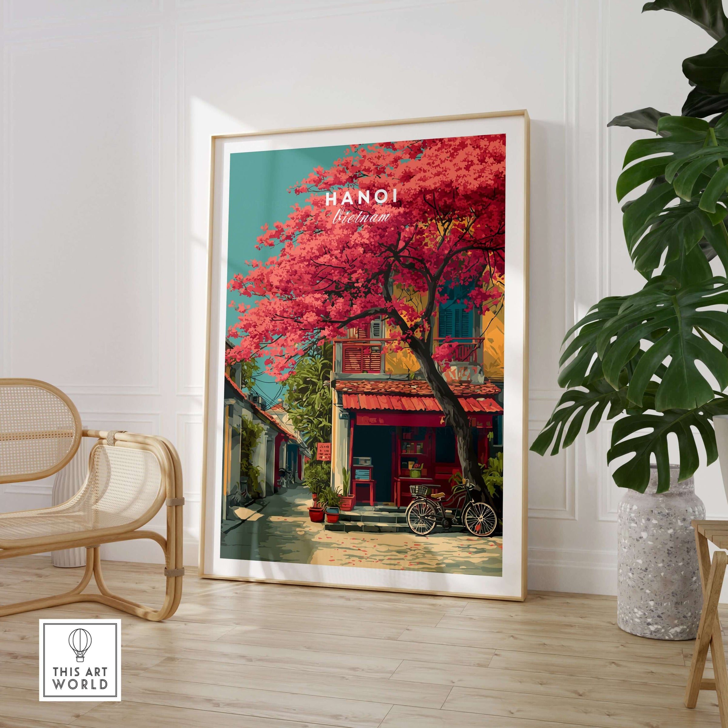 Hanoi Vietnam Print Cherry Blossom Street - Colorful City Wall Art in a stylish room with a plant and chair.