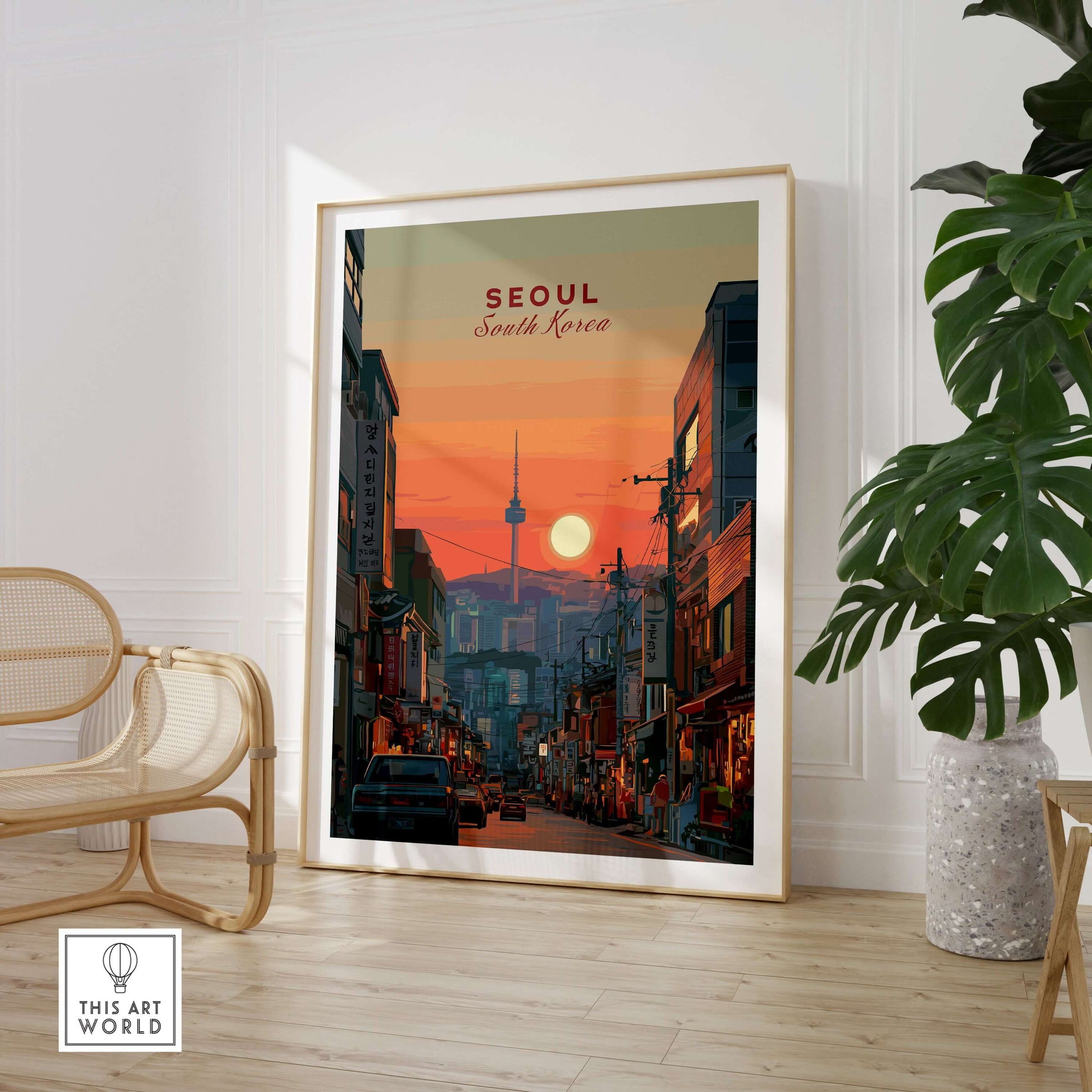Seoul South Korea City Sunset Print - N Seoul Tower Skyline Poster framed in a modern interior with a plant.