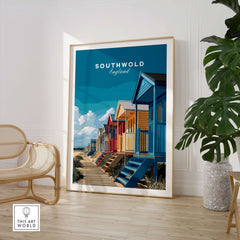 Southwold England Colorful Beach Huts Print - Suffolk Coastal Wall Art framed in a bright room with plants and modern decor.