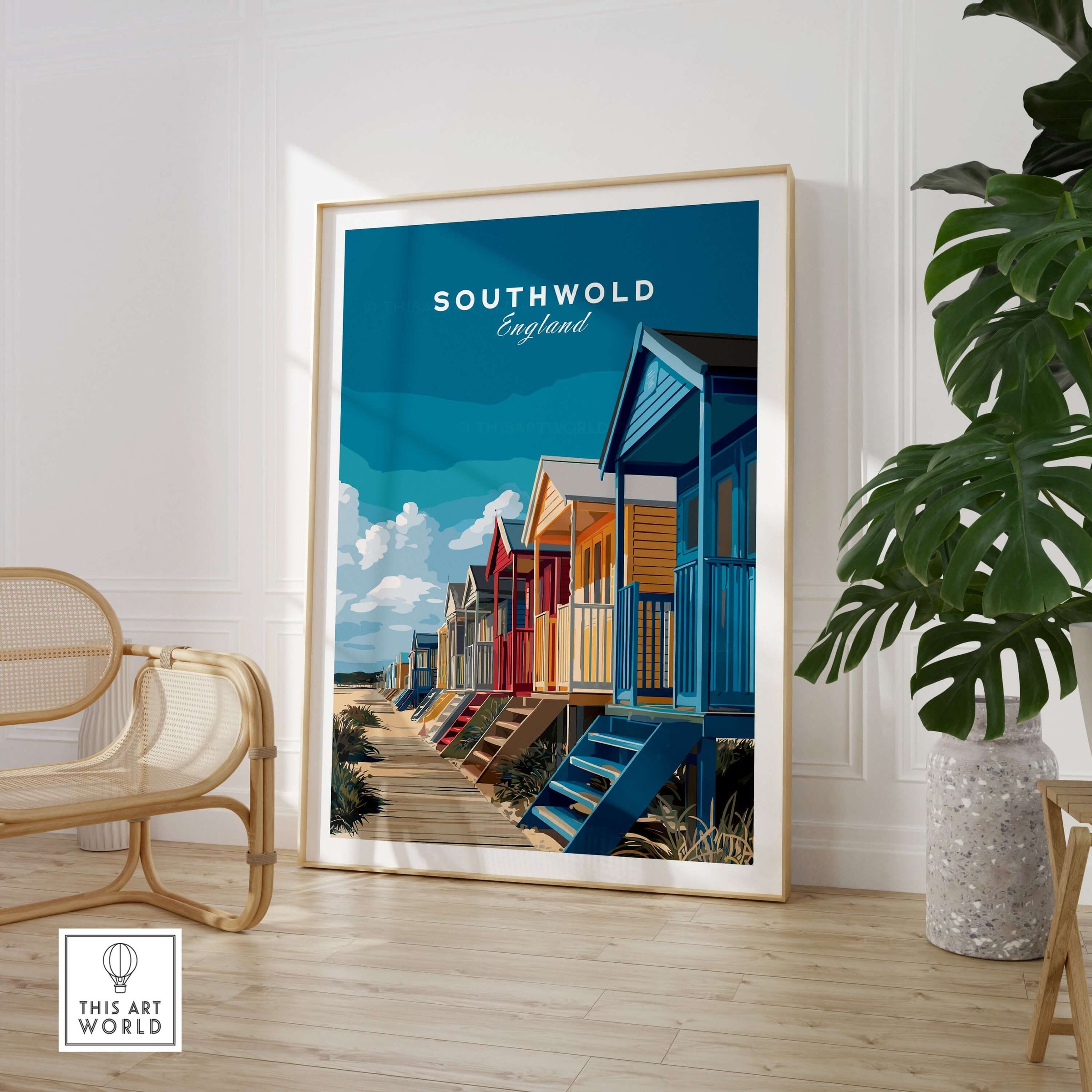 Southwold England Colorful Beach Huts Print - Suffolk Coastal Wall Art framed in a bright room with plants and modern decor.