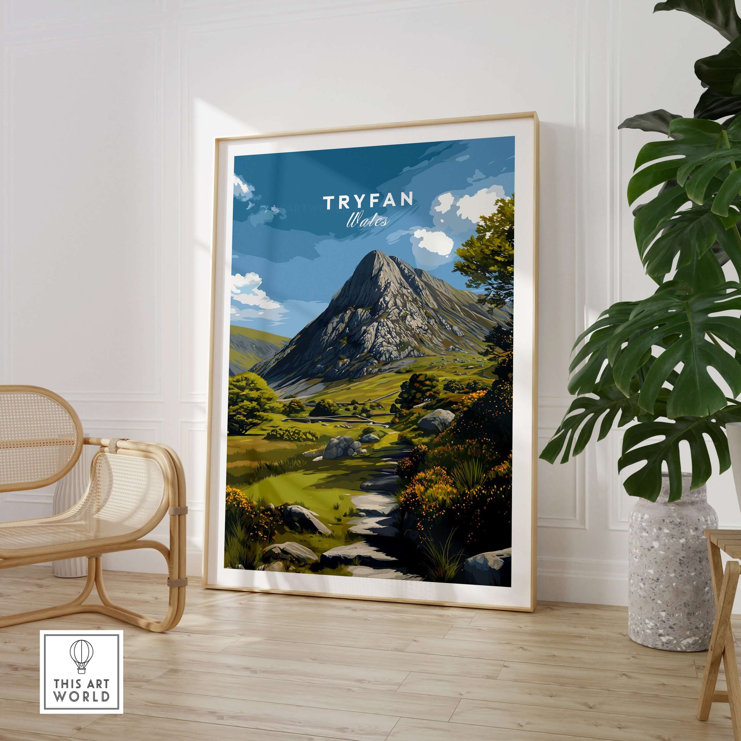 Tryfan Poster Wales Rocky Mountain Art - Scenic Welsh Highlands Print displayed in a modern room with plant and chair.