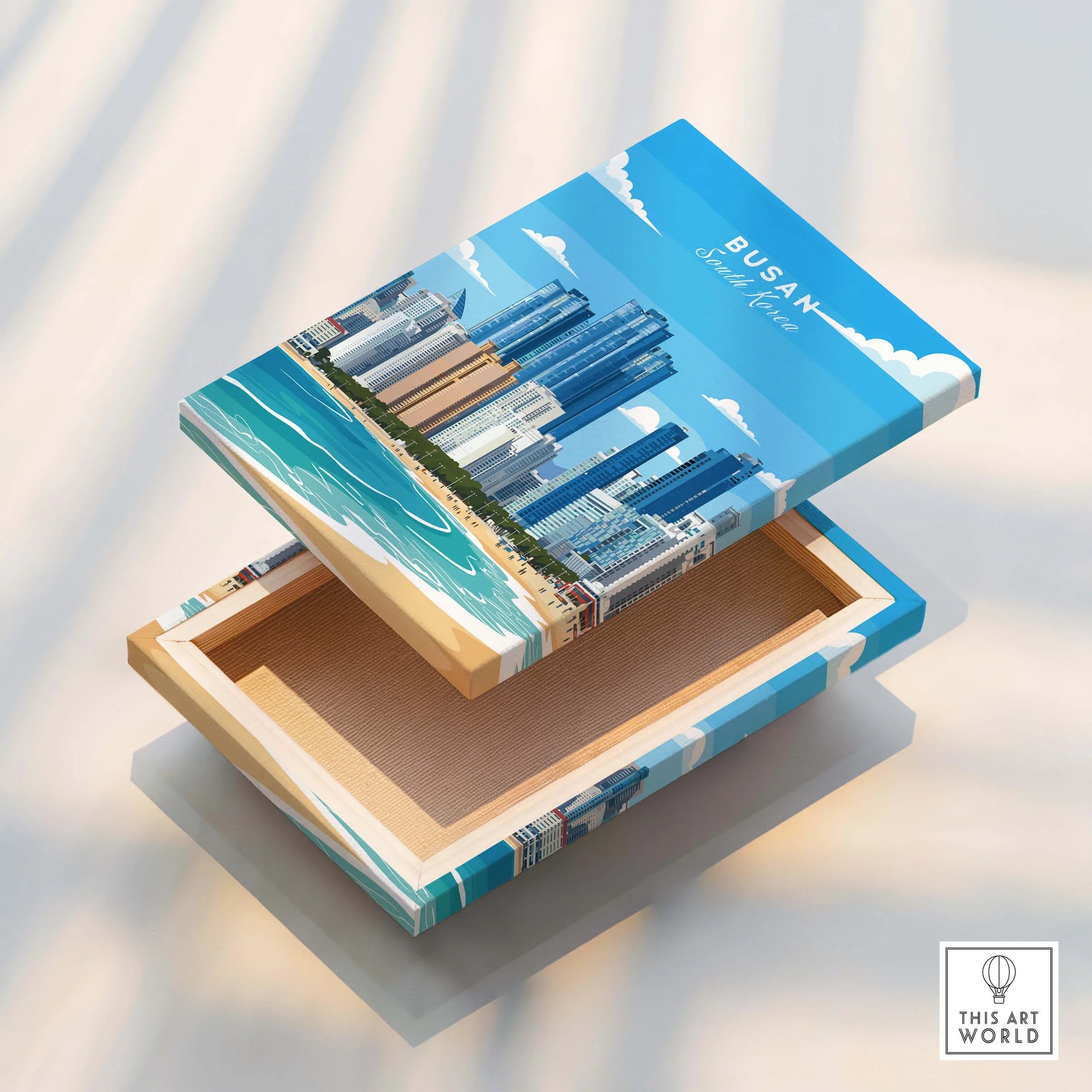 Stretched canvas print with Busan city skyline and beach wall art, floating edge detail.