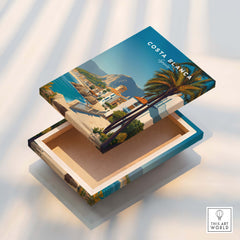 Costa Blanca Travel Poster - Spain Canvas Print featuring vibrant coastal scenery and palm trees on a decorative box.
