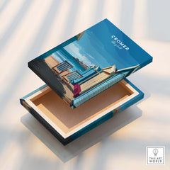 Cromer Travel Poster – Norfolk Beach Huts Art Print displayed on a decorative box featuring colorful beach huts.
