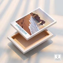 Durdle Door Dorset Wall Art – Canvas Poster displayed on a decorative box, showcasing stunning coastal art.