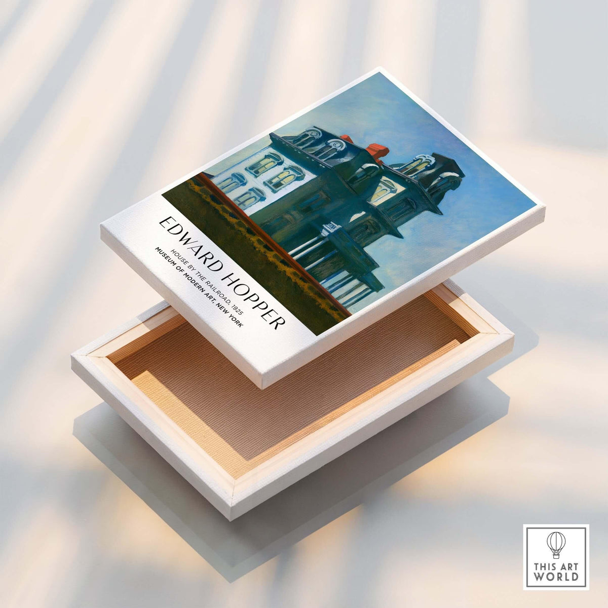 Edward Hopper House by the Railroad 1925 MoMA Art Print Poster displayed on an art box.