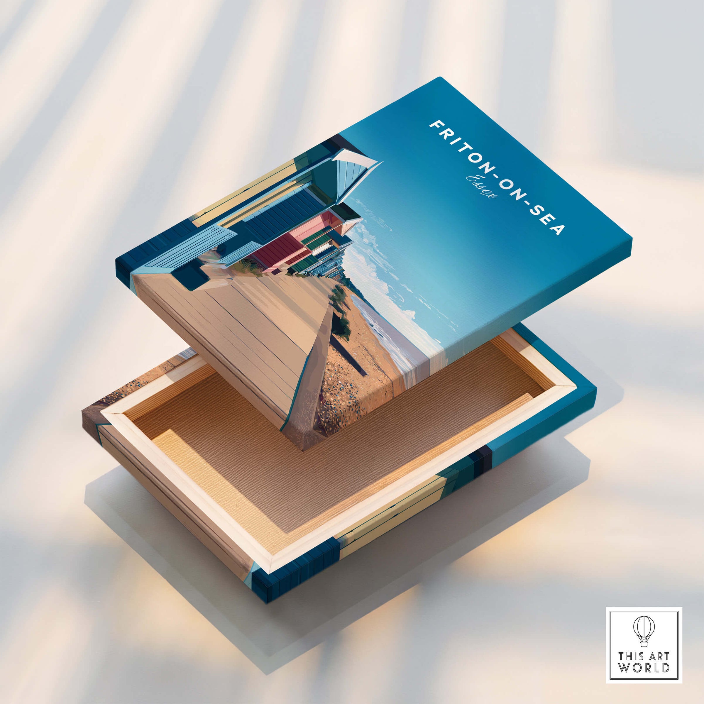 Frinton-on-Sea Travel Poster – Essex Coastline Beach Huts & Prom Art displayed on an open wooden box.