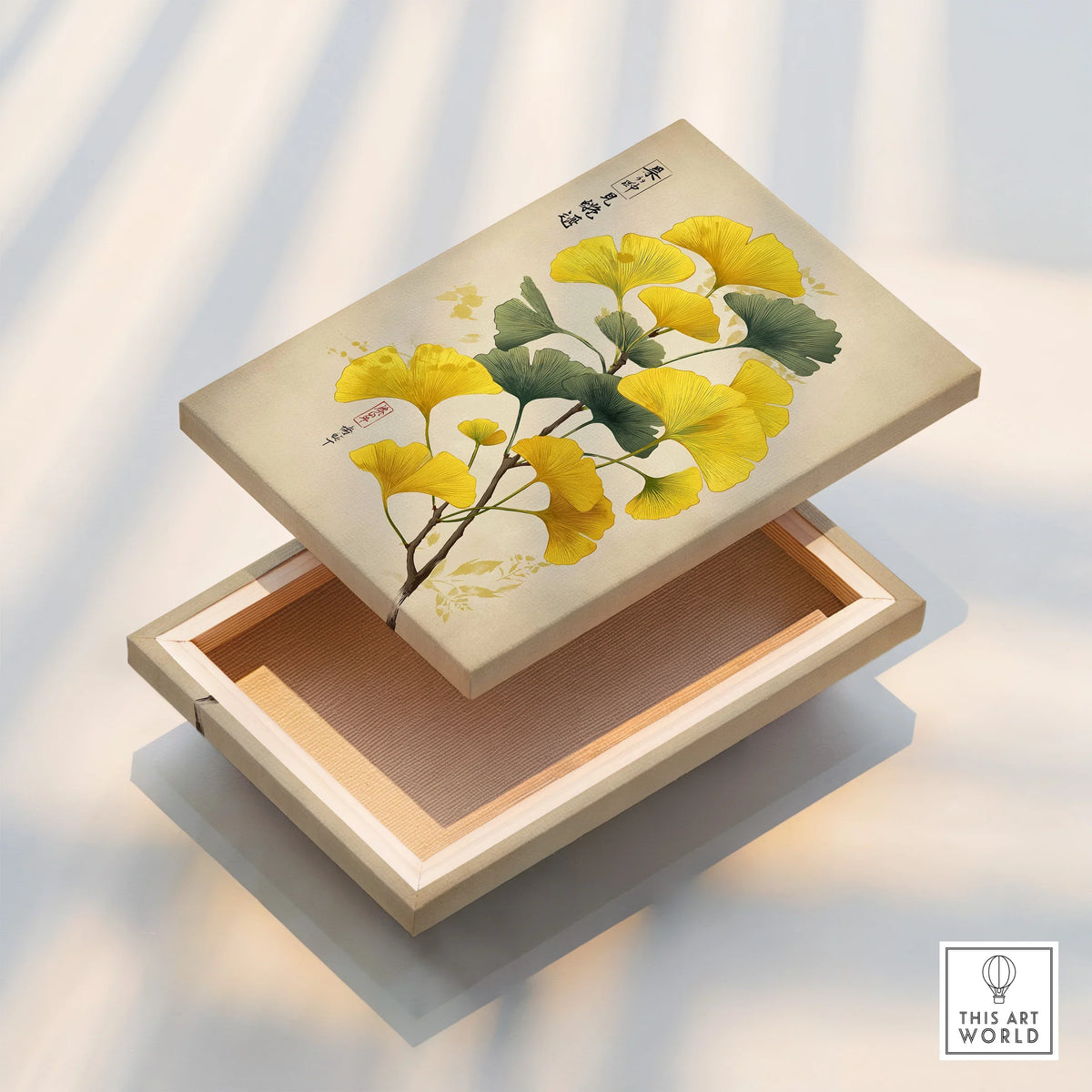 Floating canvas print with yellow ginkgo leaves and Asian art design on soft beige background