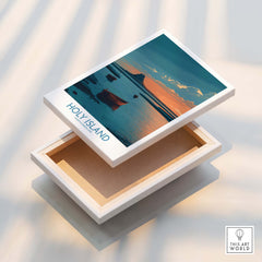 Holy Island Northumberland Poster | Coastal Castle Sunset Canvas Print displayed on a wooden box with scenic coastal design.