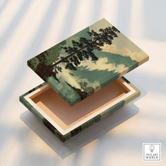 Decorative wooden box with vintage landscape art print, open lid, soft natural light