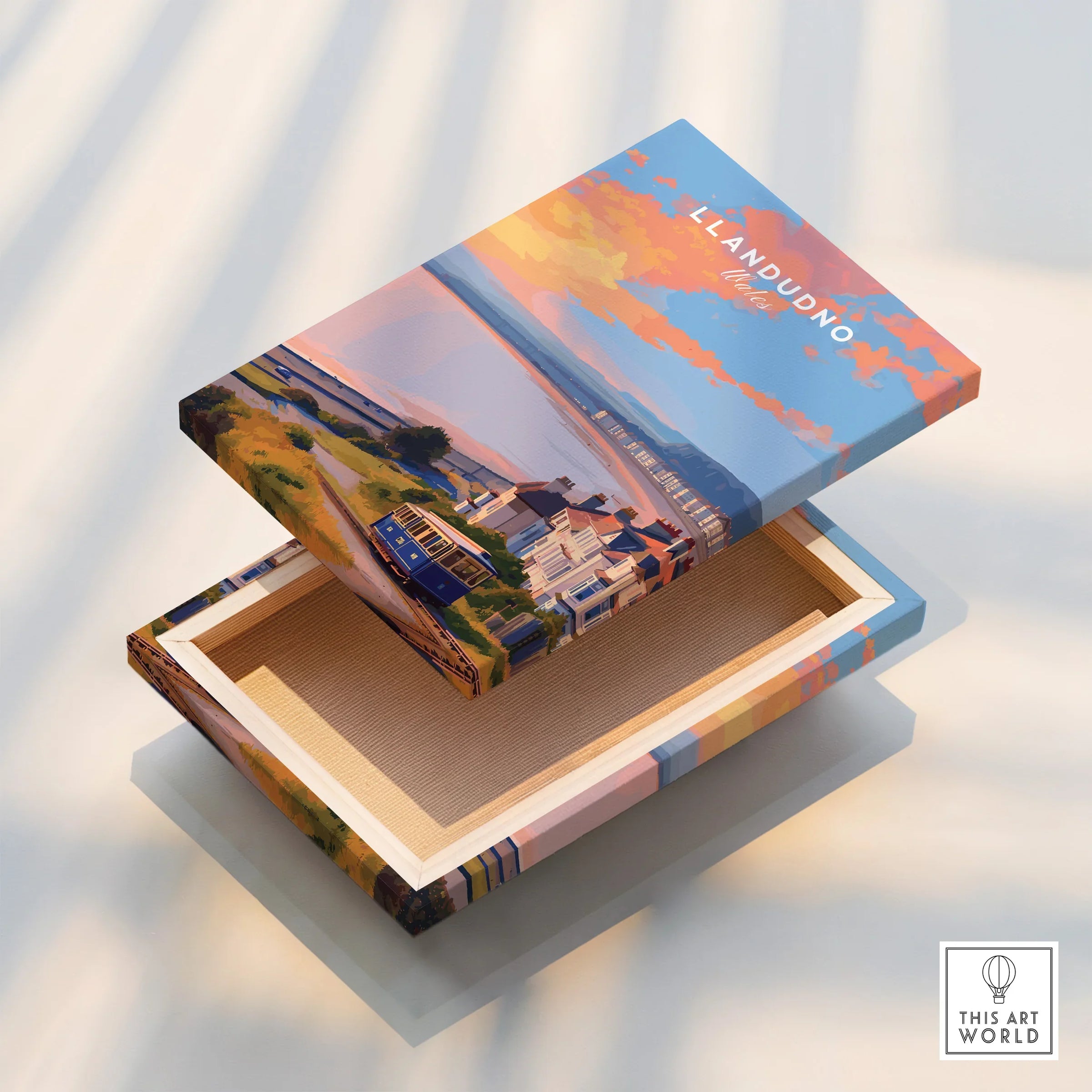 Llandudno travel art print on floating canvas box with coastal and tramway illustration.