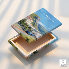 Llandudno scenic art print on a decorative box with coastal and tramway illustration.
