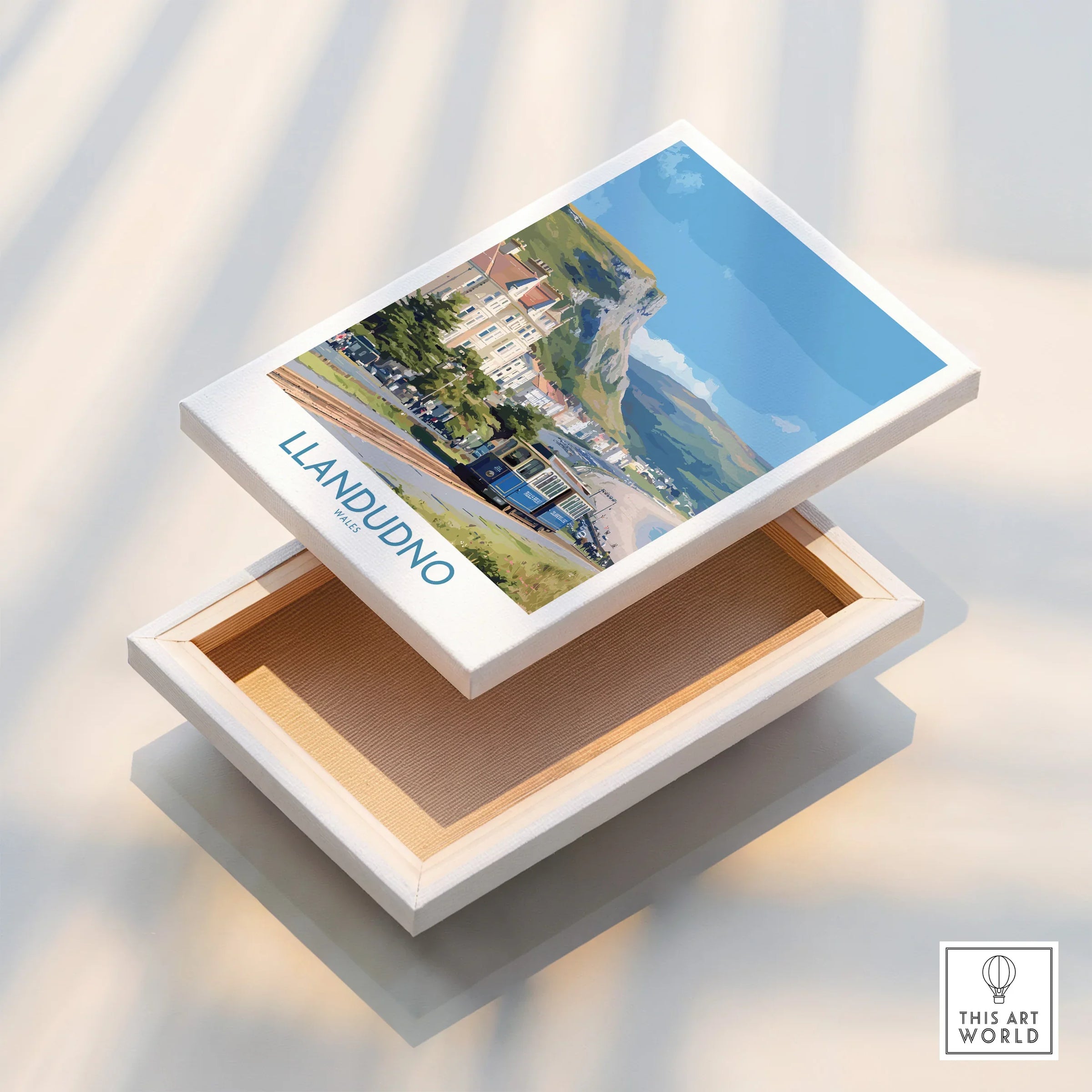 Stretched canvas print showing Llandudno Wales travel poster with tram and scenic coastline.
