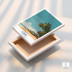 Lomé Togo Canvas Print | Tropical Coastal Village Scene Posters displayed in a box with a vibrant beach design.