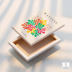 Matisse Art Prints - Interlocking Colorful Leaves Abstract Print displayed on a decorative box with vibrant leaf designs.