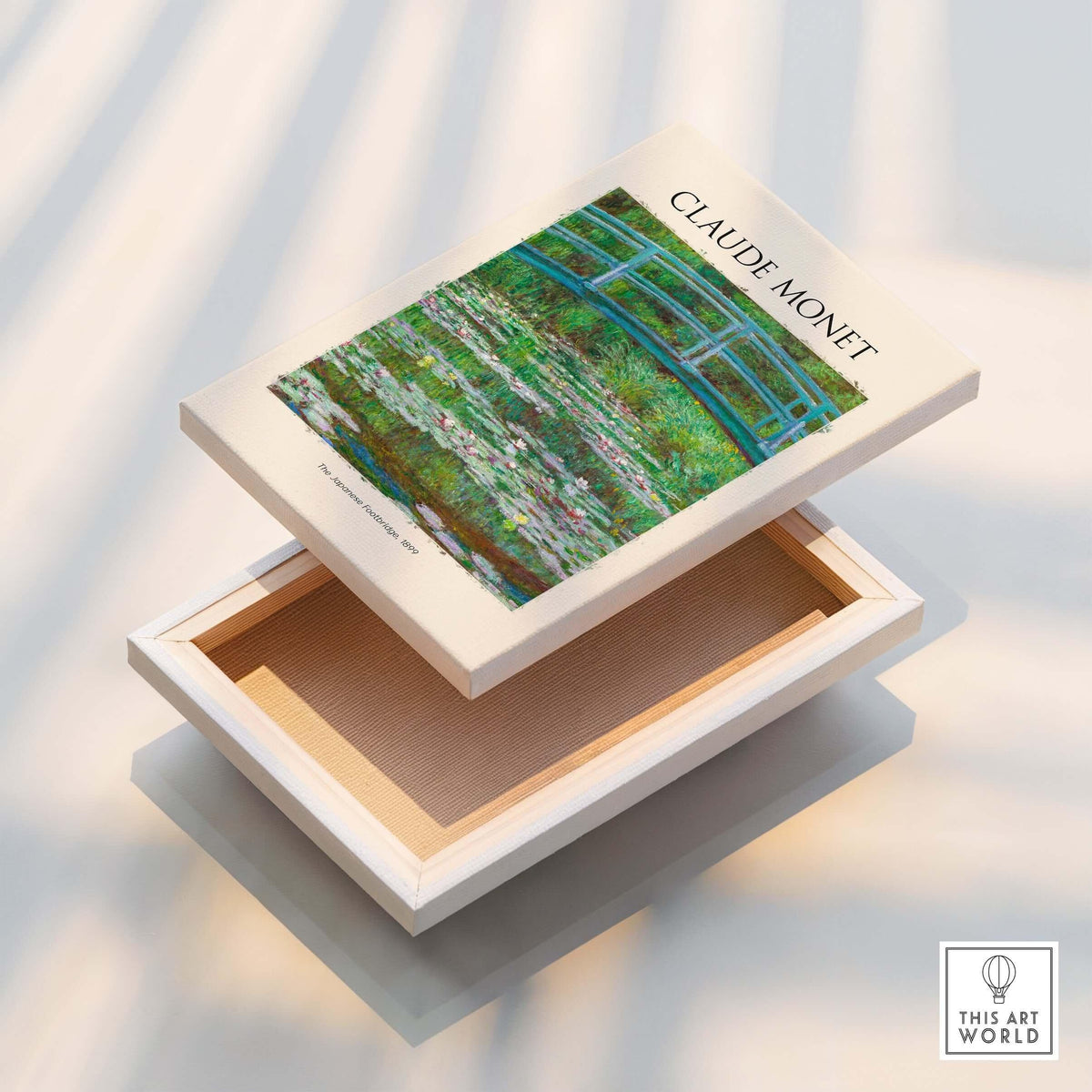 Monet Japanese Footbridge Water Lilies Giverny Garden Poster Art Print displayed on a wooden box.