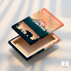 Mount Rainier National Park canvas print box with sunset, forest, and bear illustration.