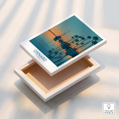 Oxnard California Poster | Scenic Pacific Marina Canvas Print on a display box with palm trees and coastal waters.