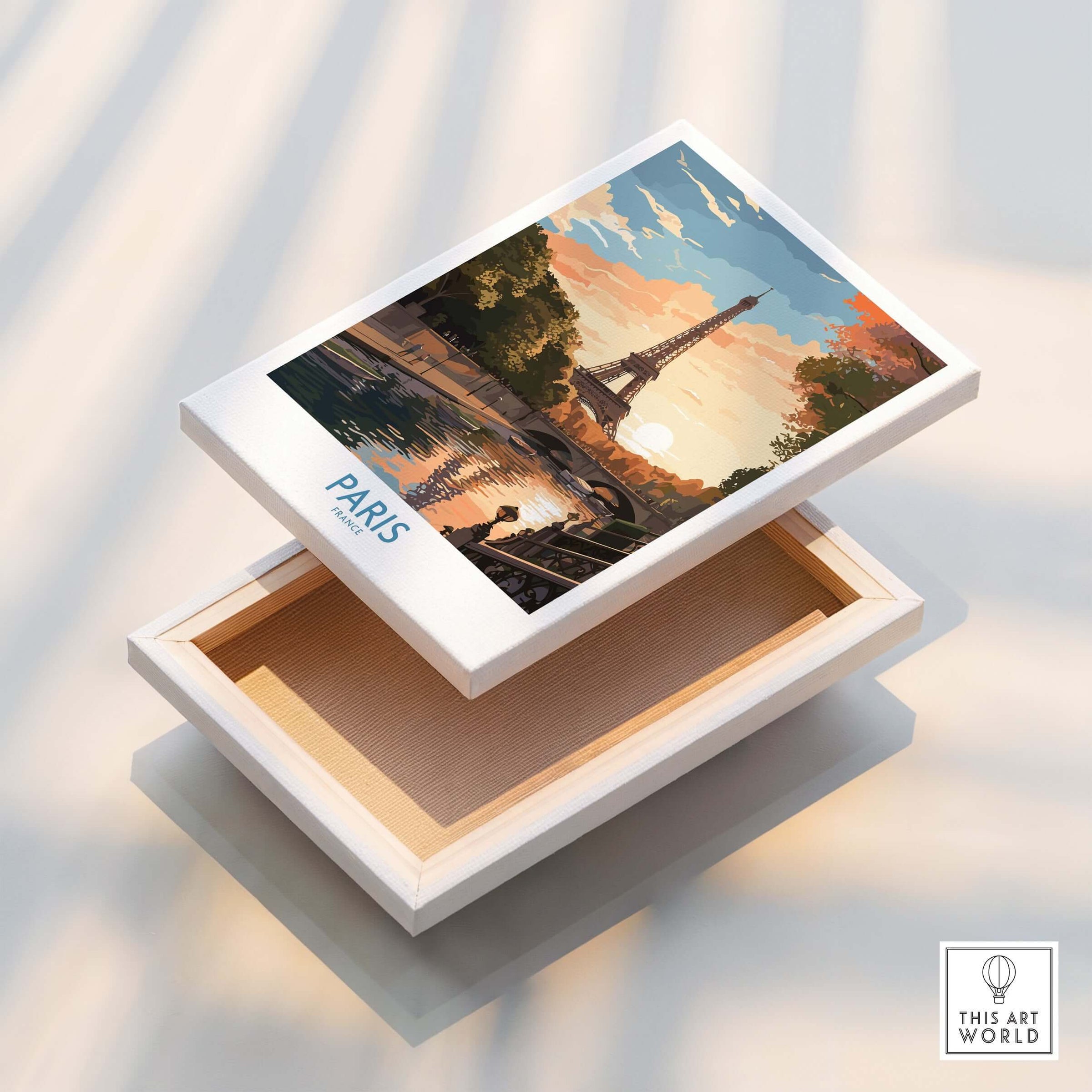 Paris Art Print displayed on a white box, showcasing vibrant sunset and Eiffel Tower.