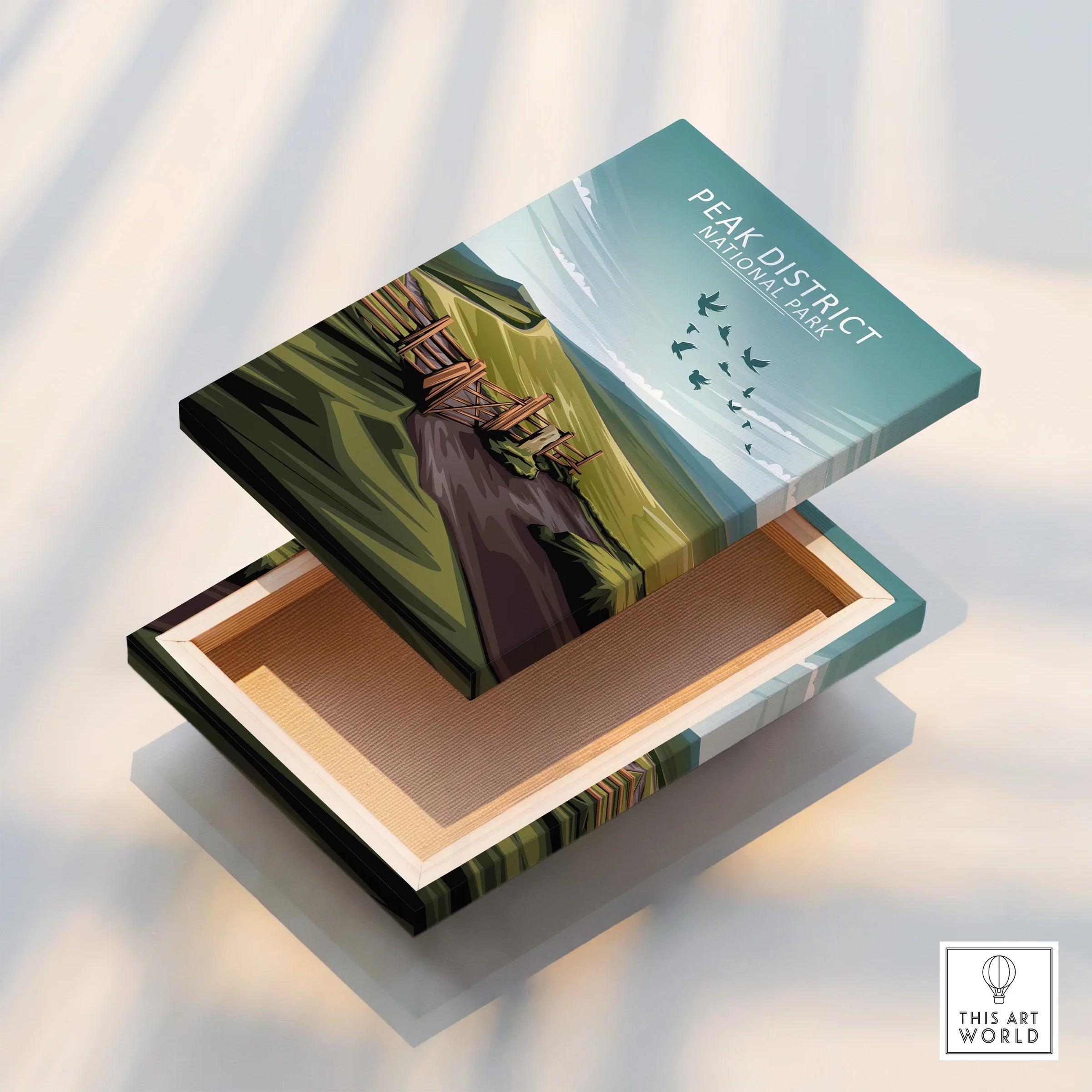 Peak District National Park wall art print with green hills, path, and birds on canvas box.