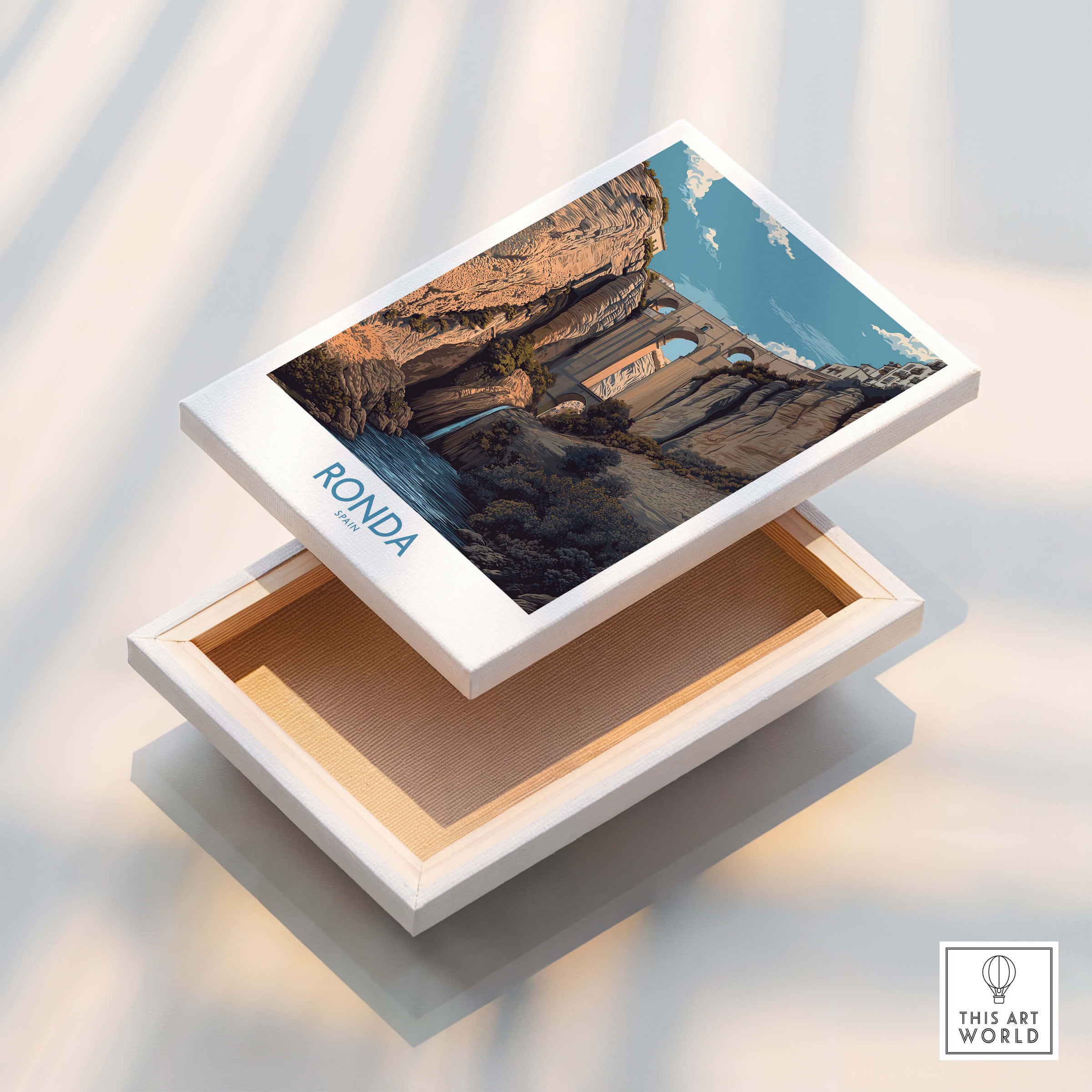 Ronda Spain Poster | Dramatic Andalusian Mountain Bridge Canvas Print displayed on a wooden box.
