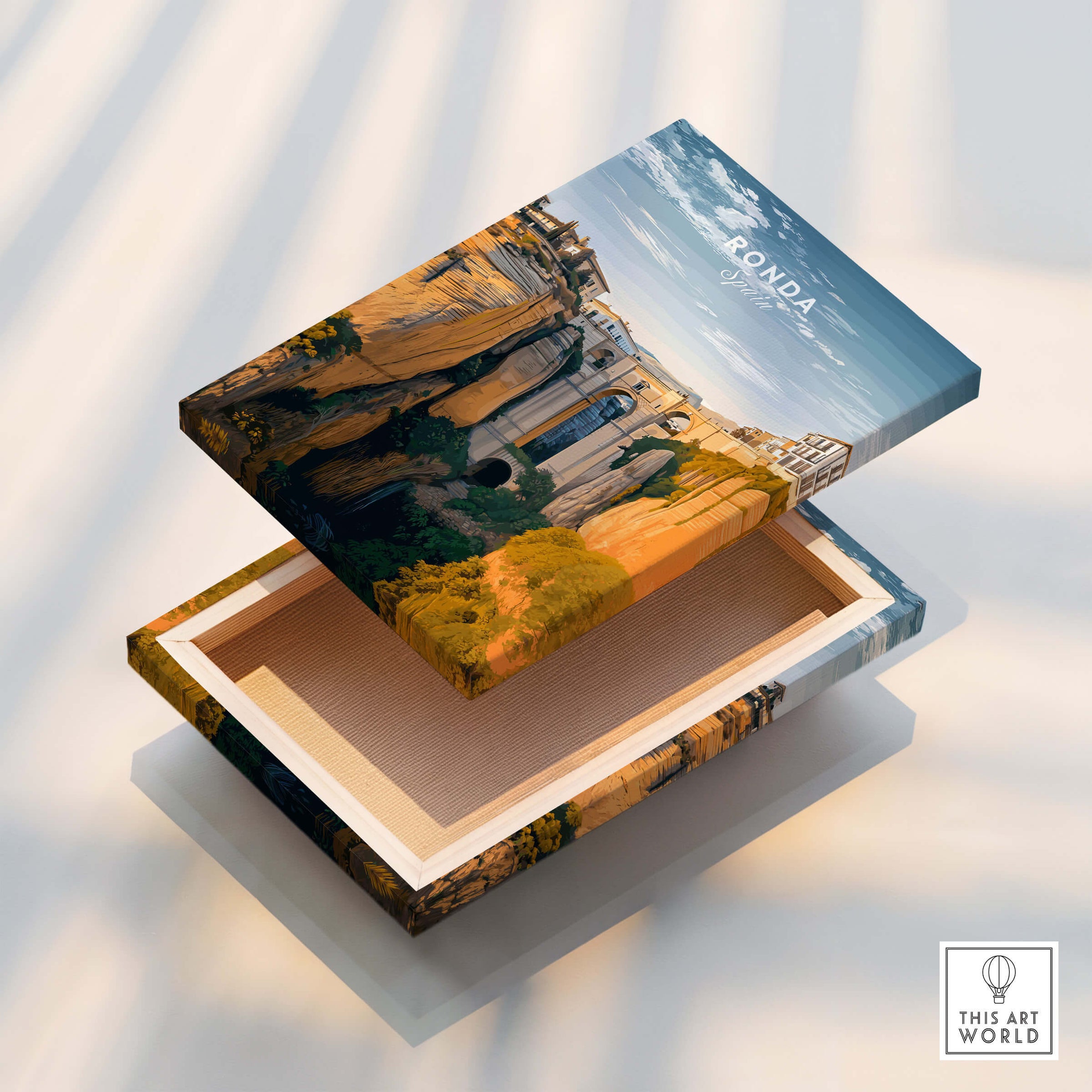 Ronda Spain Wall Art Print | Historic White Village Cliffside Travel Poster displayed on a wooden box.