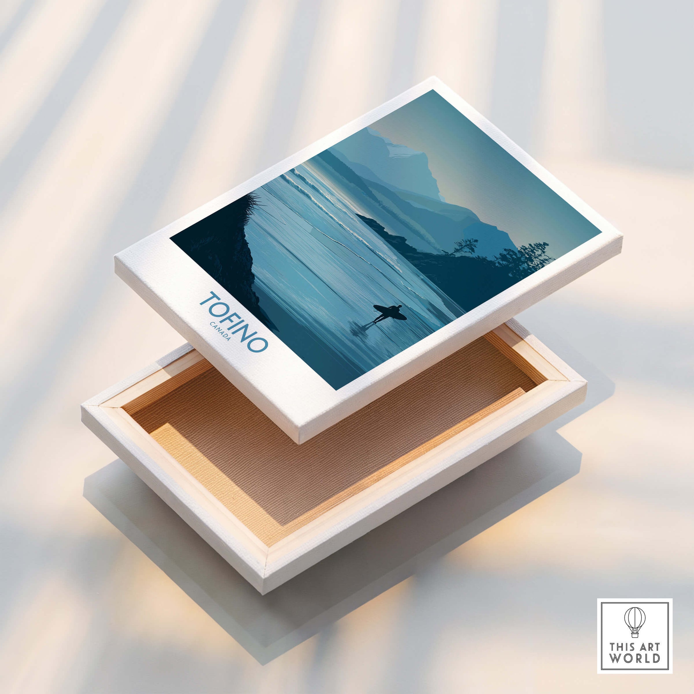 Tofino Canada Canvas Print | Misty Mountain & Shoreline Poster displayed on an open wooden box.