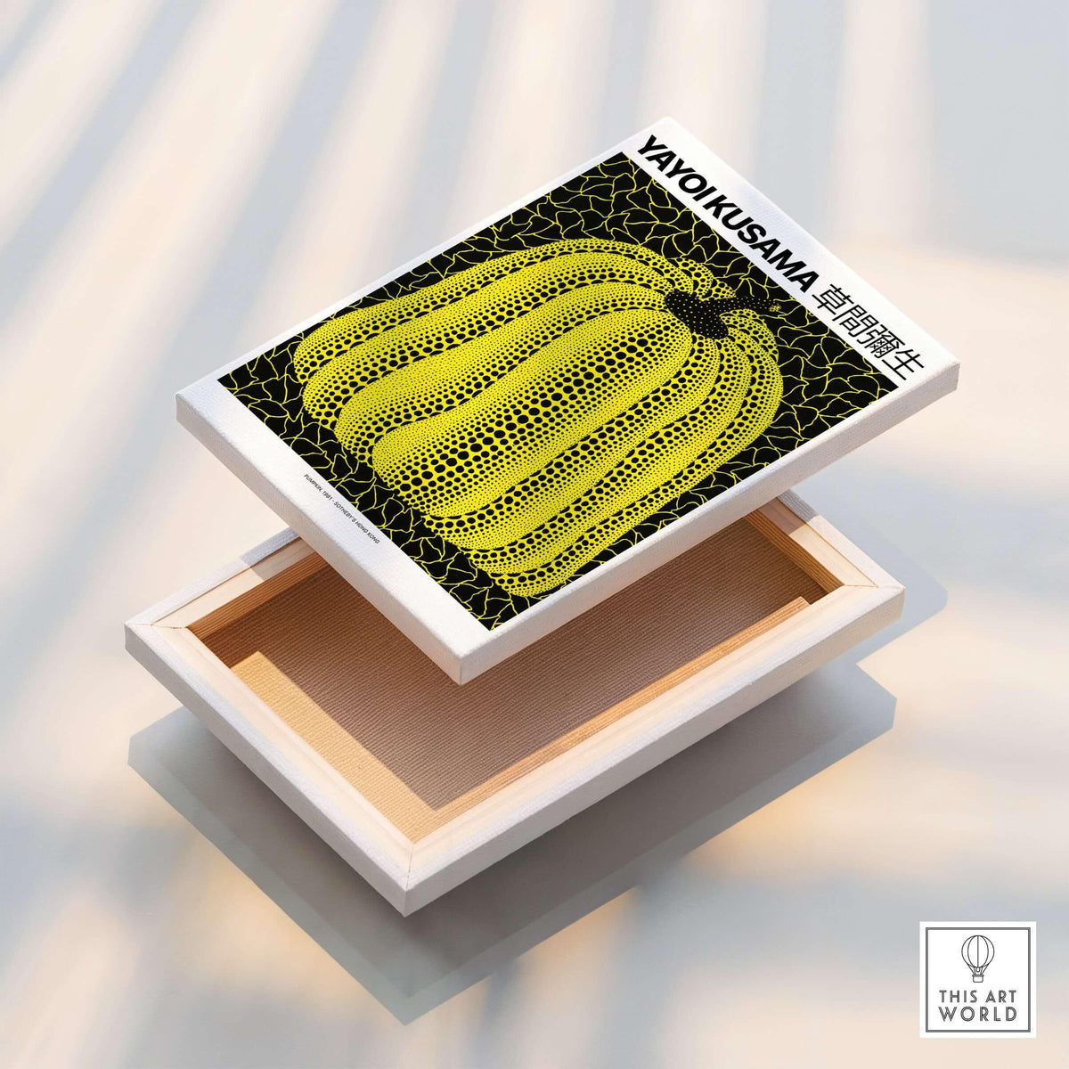 Yayoi Kusama Yellow Black Pumpkin 1991 Hong Kong Art Print Poster Polka Dot Decor on a display box.
