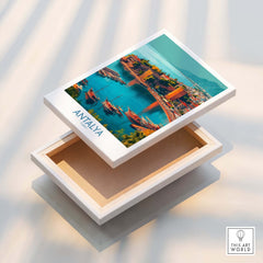 Antalya Turkey Kaleci Port Art Print | Historic Red Tower Poster displayed on a box, showcasing coastal views and vibrant colors.