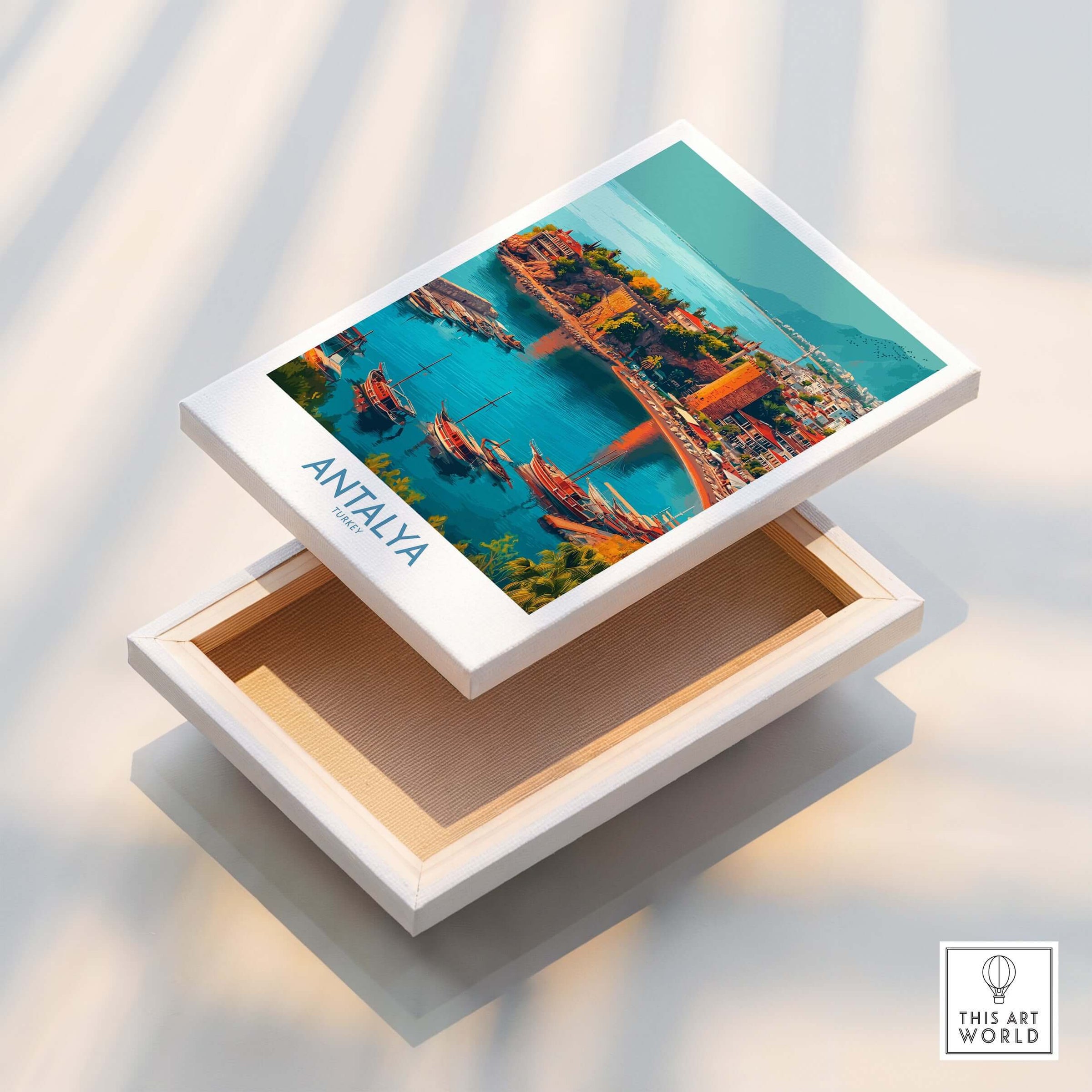 Antalya Turkey Kaleci Port Art Print | Historic Red Tower Poster displayed on a box, showcasing coastal views and vibrant colors.