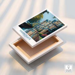 Harrogate Yorkshire Victorian Terrace Art Print | Rainy Street Poster displayed on a wooden box.
