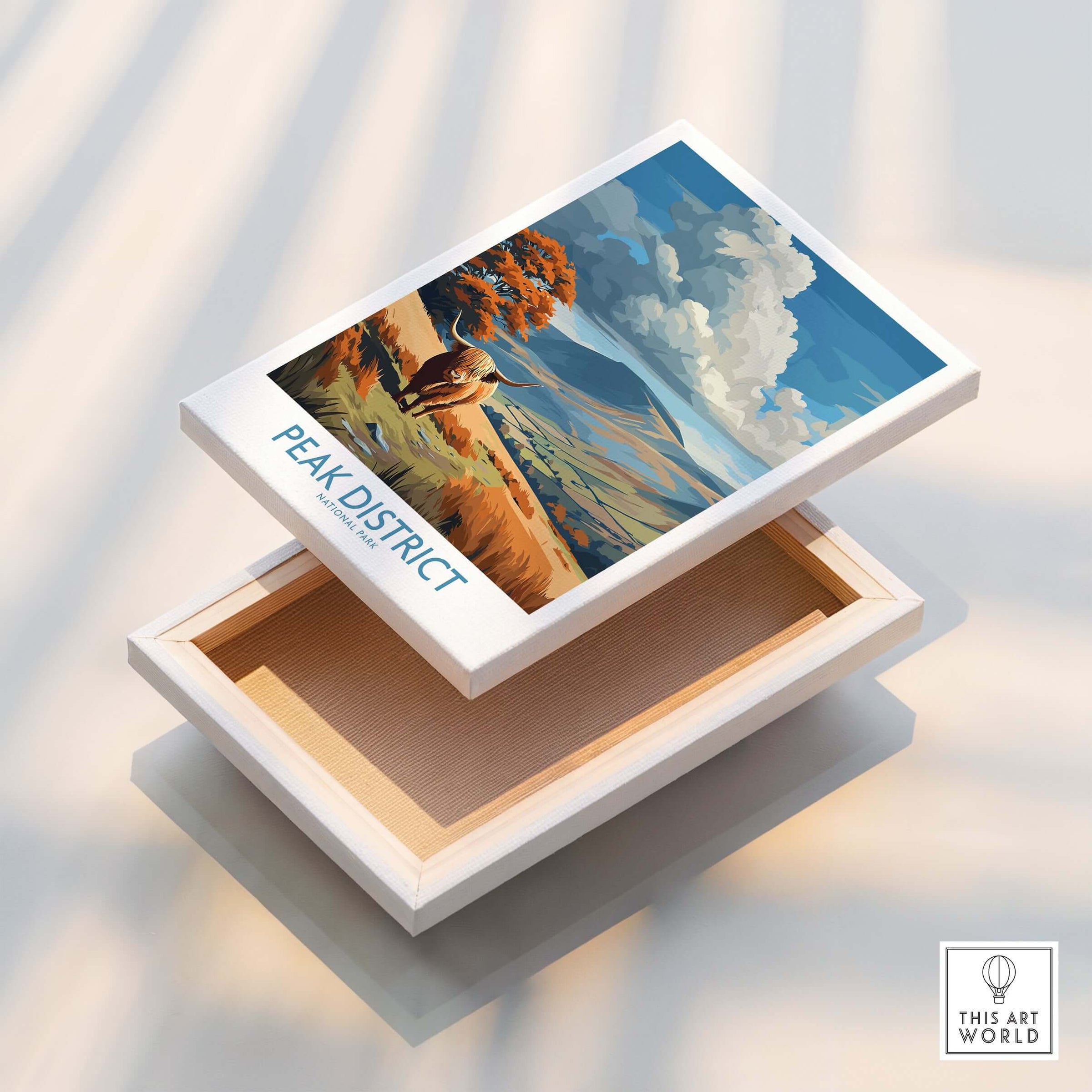 Peak District National Park Highland Cattle Art Print | Rolling Hills Poster displayed on a decorative box.