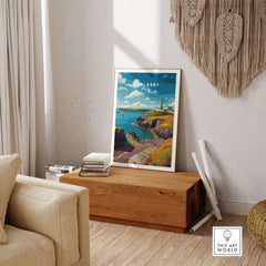 Anglesey Wales Sailboats & Lighthouse Print - Nautical Coastal Wall Art displayed in a cozy living room setting.