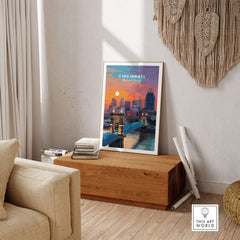 Cincinnati Ohio Sunset Skyline Poster - Roebling Bridge Wall Art displayed in a cozy living room setting.