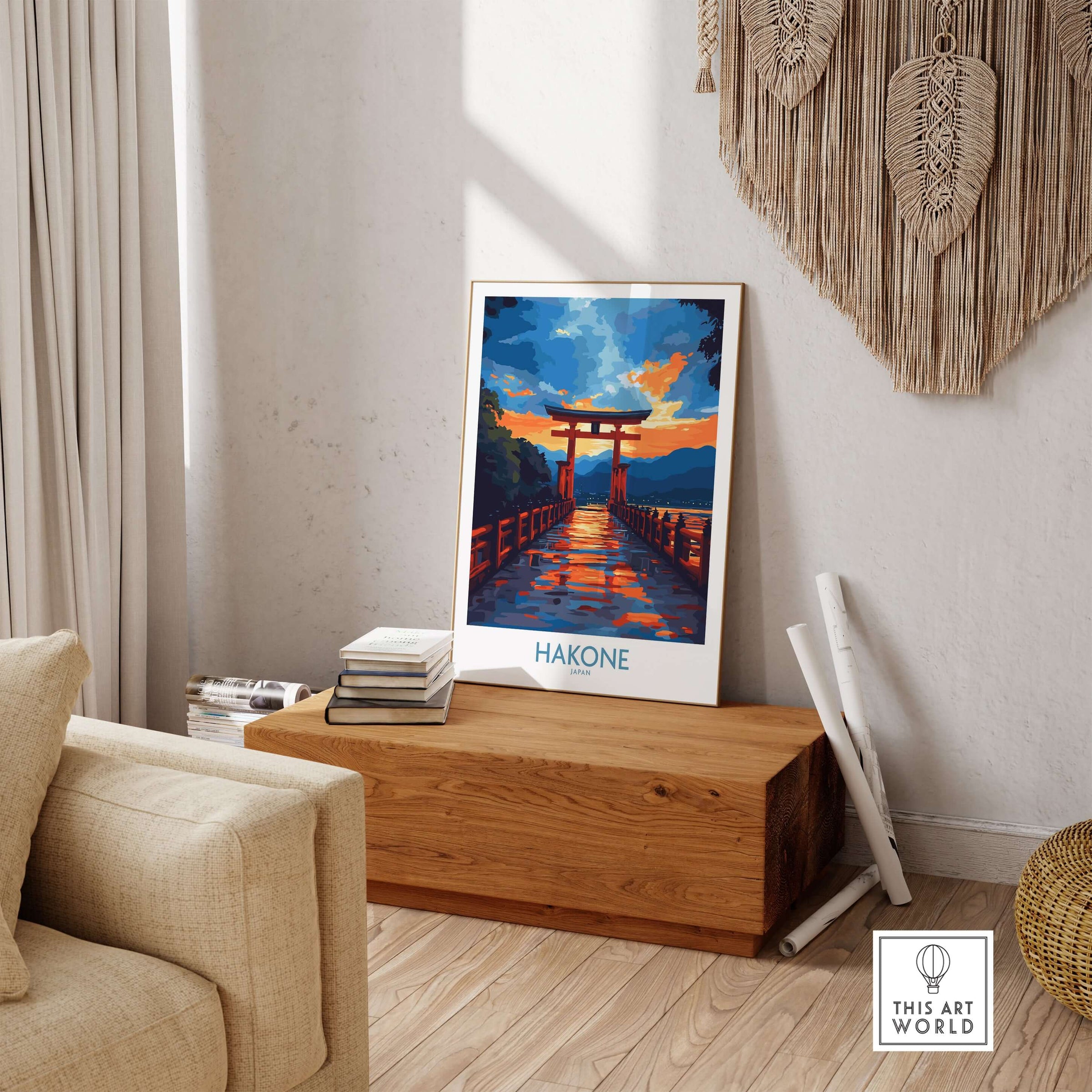 Hakone Wall Art - Japan Travel Poster displayed in a cozy living room setting on a wooden bench.