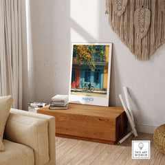 Hanoi Poster - Vietnam Wall Art displayed in a cozy living room setting with wooden decor.