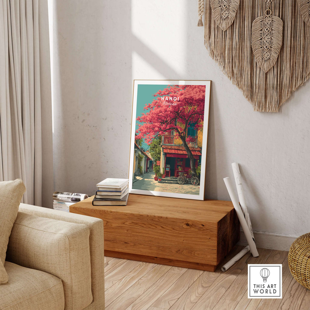 Colorful wall art print of cherry blossom street in Hanoi, Vietnam, displayed in a cozy living room setting.