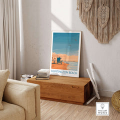 Huntington Beach Surfing Beach Poster - California Travel Decor displayed in a modern living room with natural decor.