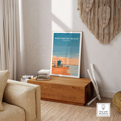 Huntington Beach Lifeguard Tower Print - California Sunset Wall Art displayed in a cozy living room setting.