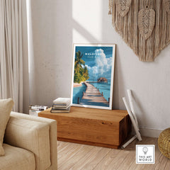 Maldives Travel Print - Beach Scene displayed in a stylish living room setting with a wooden box.