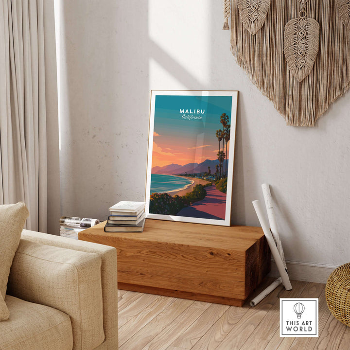 Malibu California beach sunset print displayed in a cozy living room with a wooden table and modern decor.