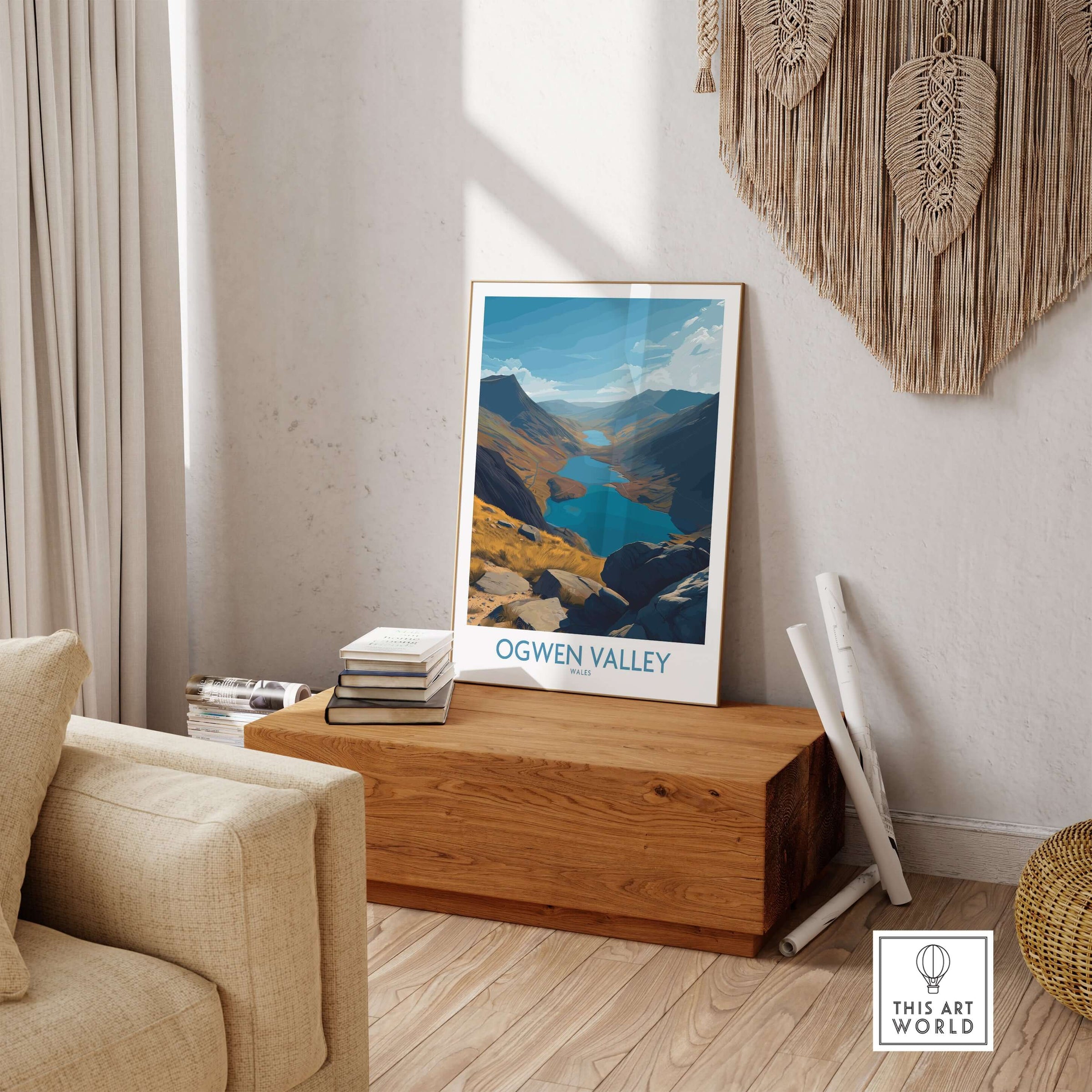Ogwen Valley Wales Poster Blue Lakes & Peaks - Welsh Wilderness Decor displayed in a cozy living space beside a wooden box.