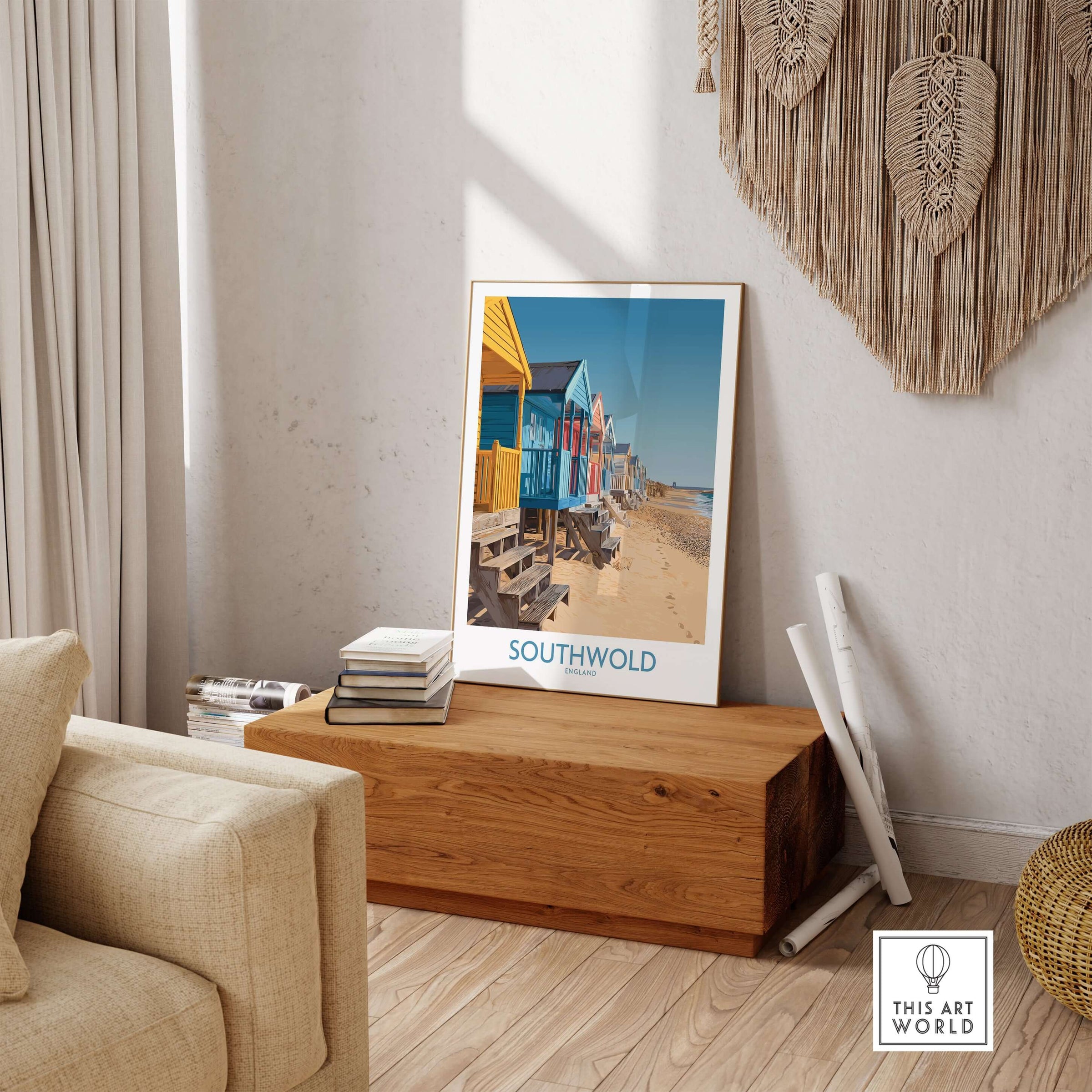 Southwold England Travel Poster displayed in a cozy living room with beach huts and natural decor.