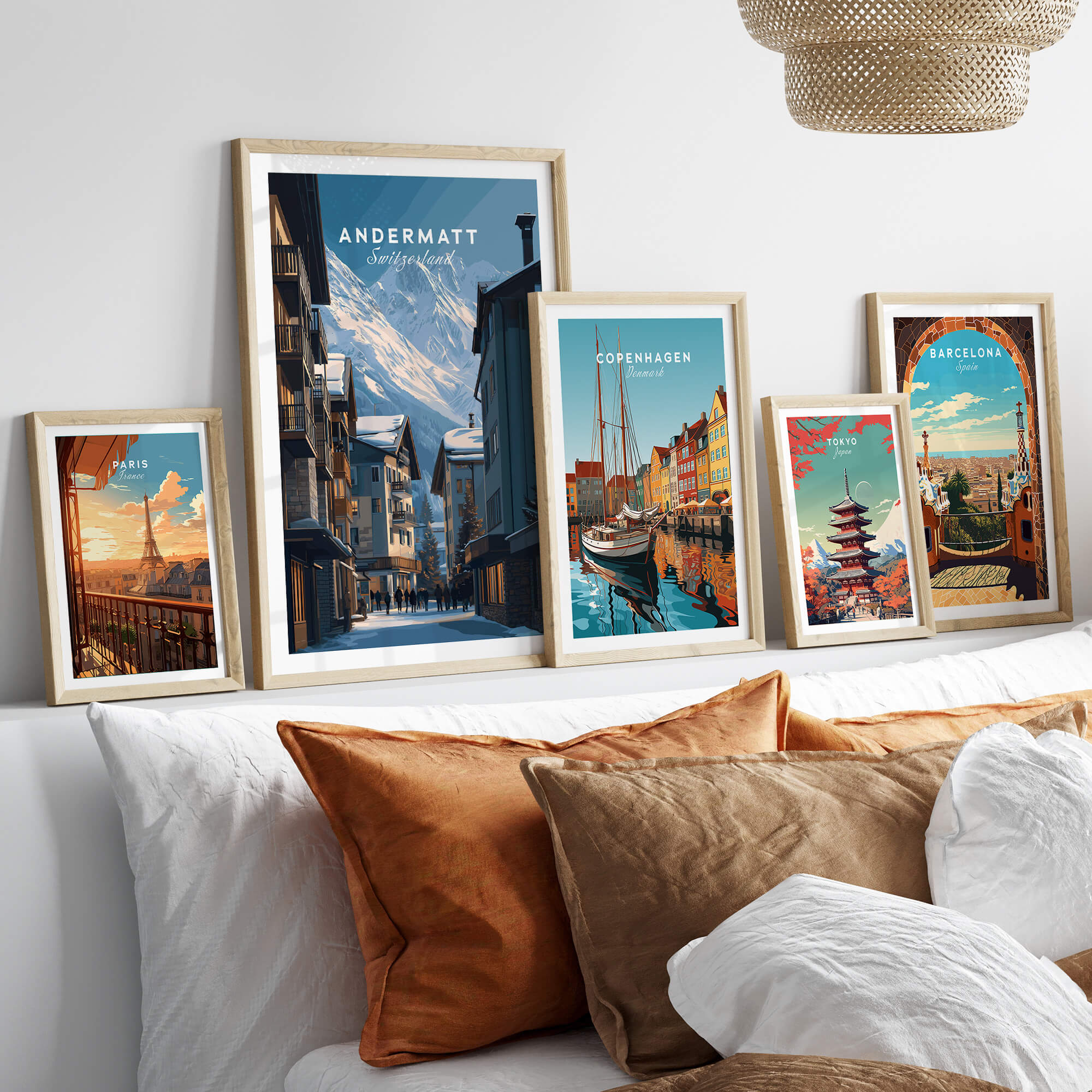 Andermatt Travel Poster – Swiss Alps Winter Village and Chalet Print displayed among other travel posters in a cozy setting.