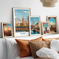 Asmara Eritrea Wall Art – Travel Poster collection displayed in stylish frames on a couch with decorative pillows.