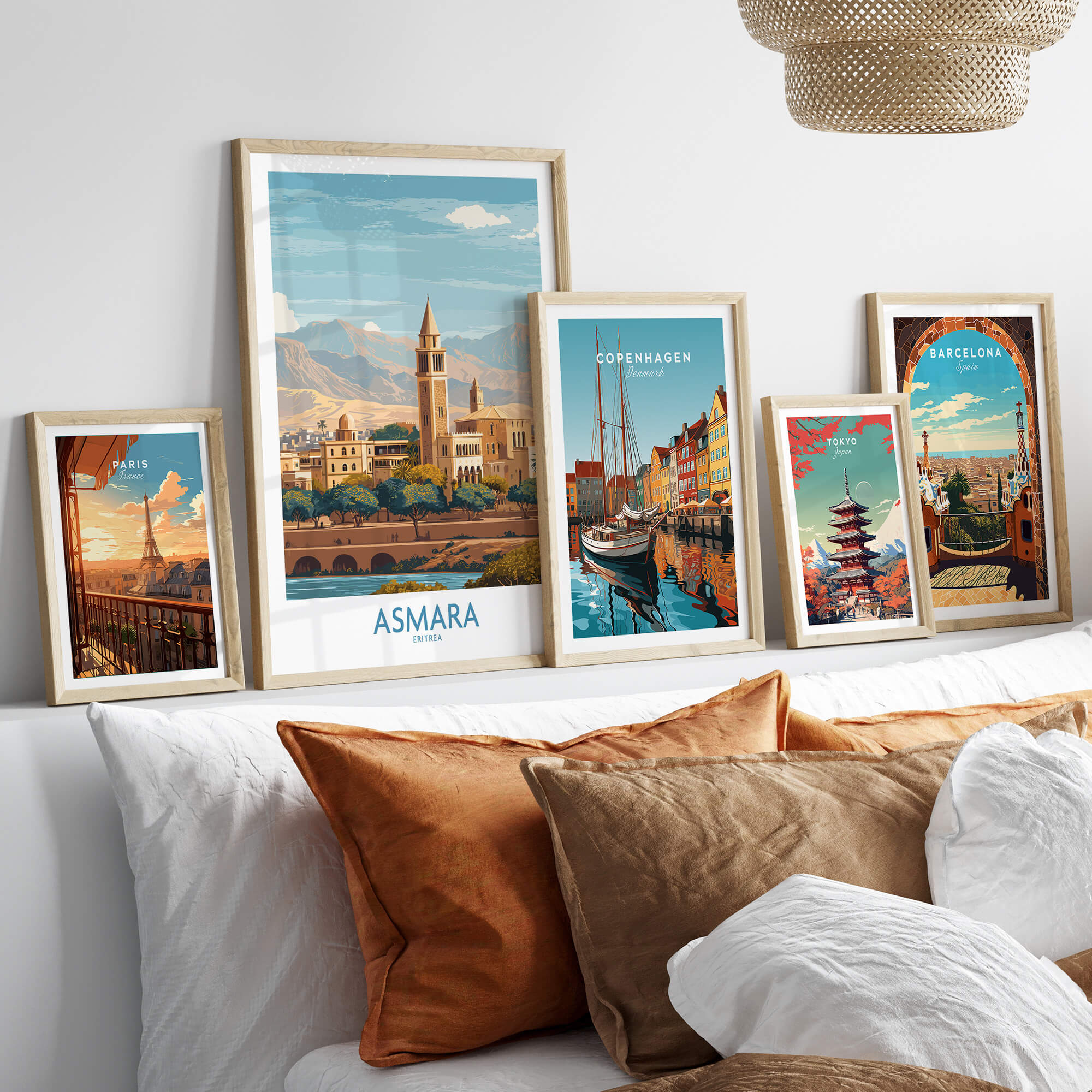 Asmara Eritrea Wall Art – Travel Poster collection displayed in stylish frames on a couch with decorative pillows.